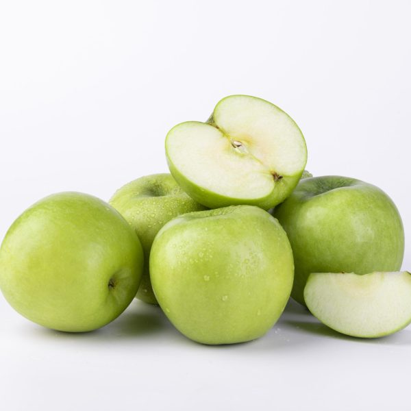 A closeup shot of fresh sliced green apples isolated on white background