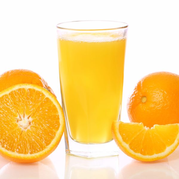 Fresh and cold orange juice against white background