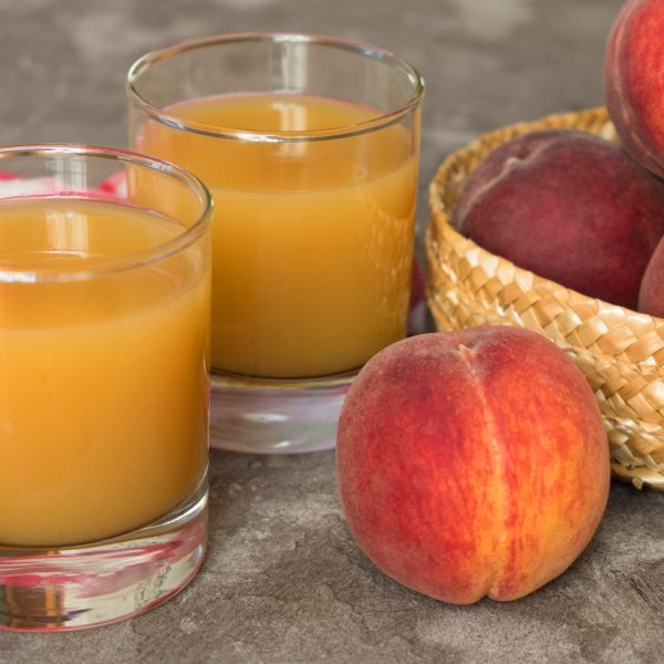two-glasses-with-peach-juice-closeup